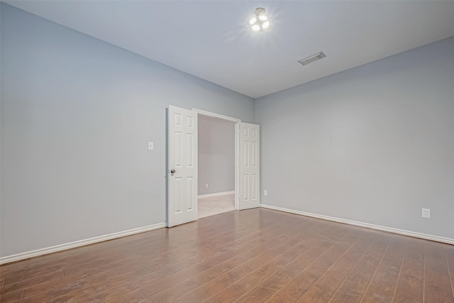 unfurnished room featuring light hardwood / wood-style floors