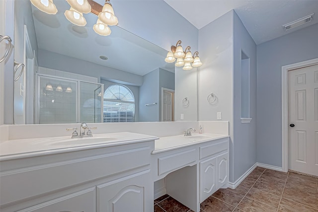 bathroom featuring vanity and a shower with shower door