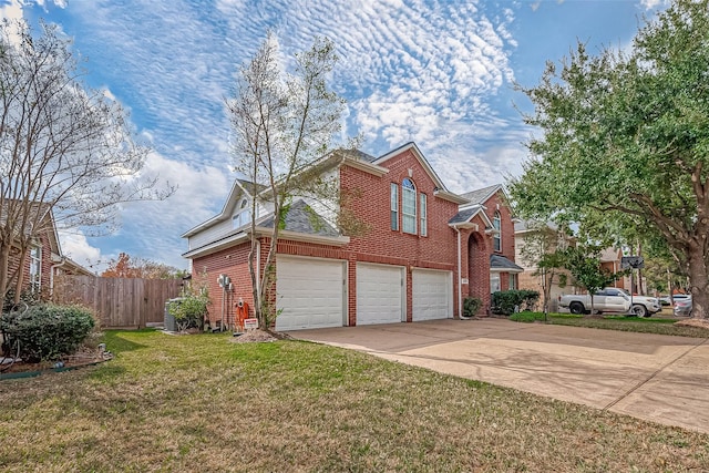 view of front facade with a front yard and a garage