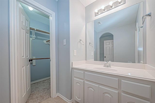 bathroom with vanity and tile patterned floors