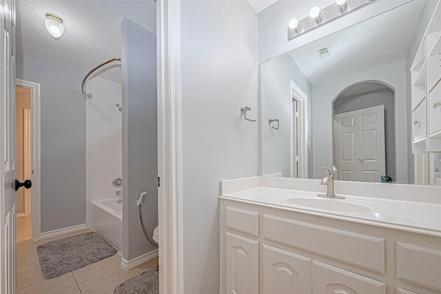 full bathroom with tile patterned flooring, vanity, toilet, and tub / shower combination