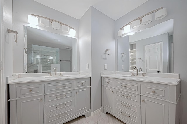 bathroom featuring vanity and a shower with shower door