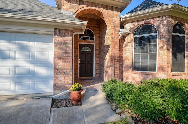 doorway to property featuring a garage