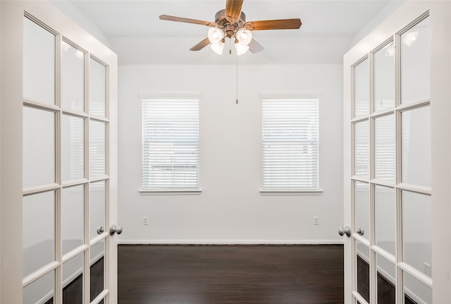 unfurnished room with ceiling fan and dark hardwood / wood-style floors