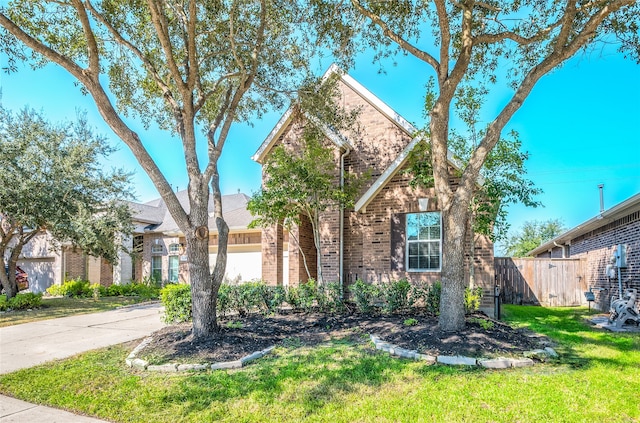 view of front facade featuring a front yard and a garage