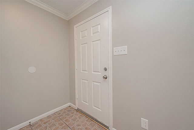 doorway to outside featuring ornamental molding and light tile patterned flooring