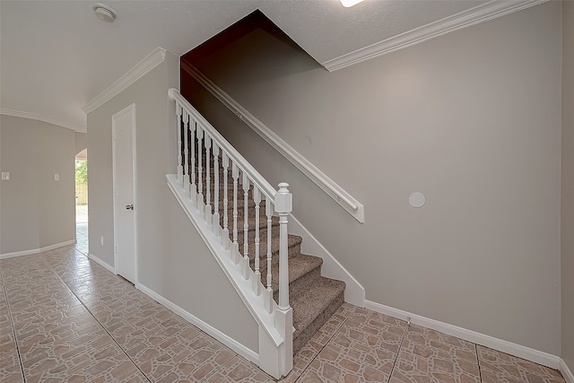 staircase featuring crown molding