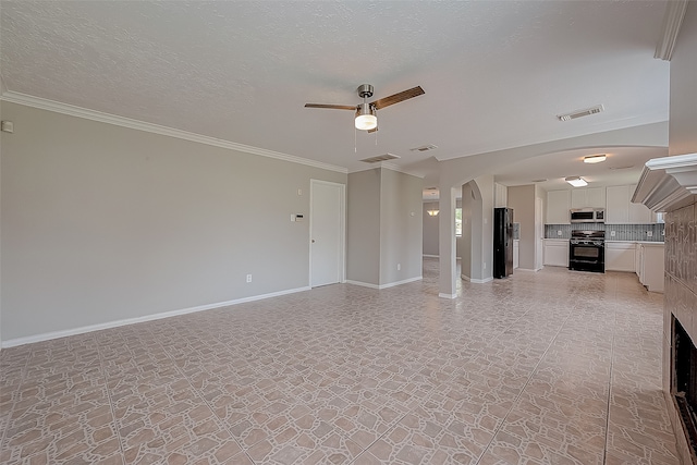 unfurnished living room featuring ornamental molding, a textured ceiling, and ceiling fan