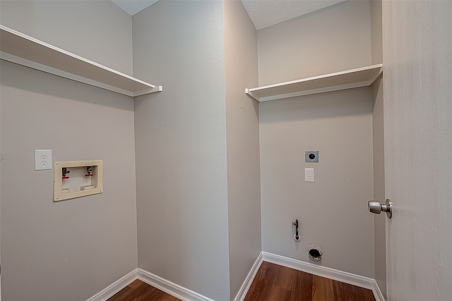 clothes washing area with washer hookup, hookup for a gas dryer, hookup for an electric dryer, and dark hardwood / wood-style floors