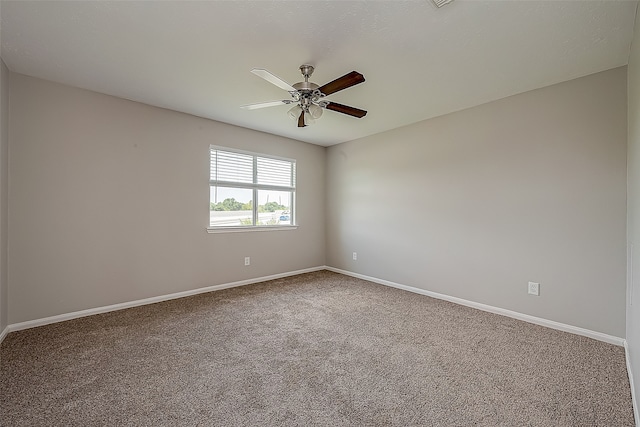 spare room with carpet flooring and ceiling fan