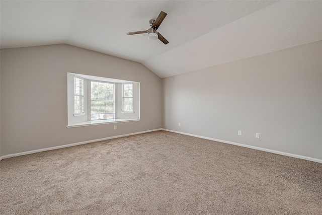 bonus room with vaulted ceiling, carpet, and ceiling fan