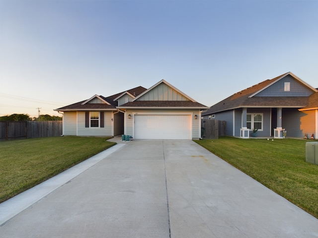 view of front facade featuring a garage and a yard