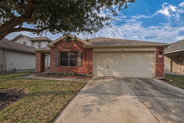 ranch-style home featuring driveway, an attached garage, a front lawn, and brick siding