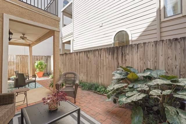 view of patio featuring ceiling fan