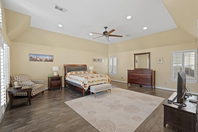 bedroom with vaulted ceiling, ceiling fan, and dark hardwood / wood-style floors