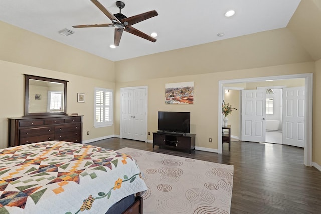 bedroom with a closet, vaulted ceiling, ceiling fan, and dark wood-type flooring