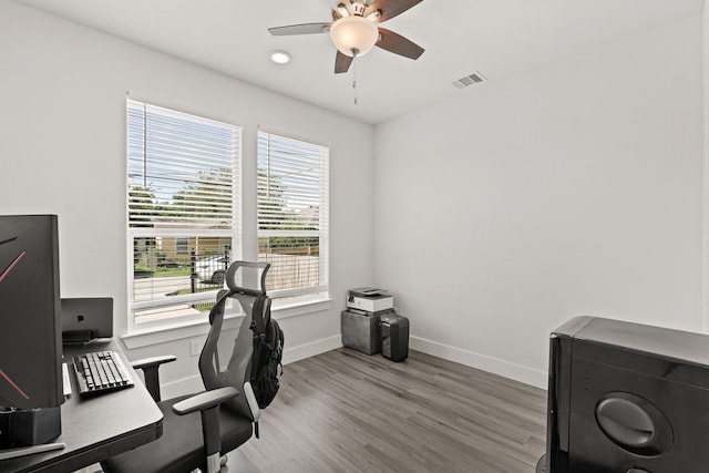 office area with ceiling fan and hardwood / wood-style floors