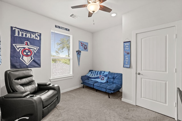 sitting room with light carpet and ceiling fan