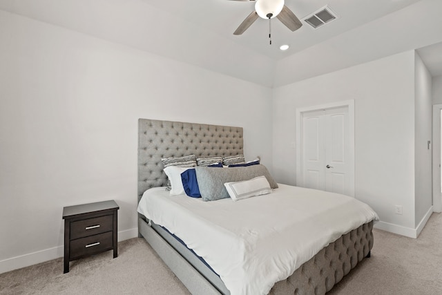 carpeted bedroom featuring a closet and ceiling fan