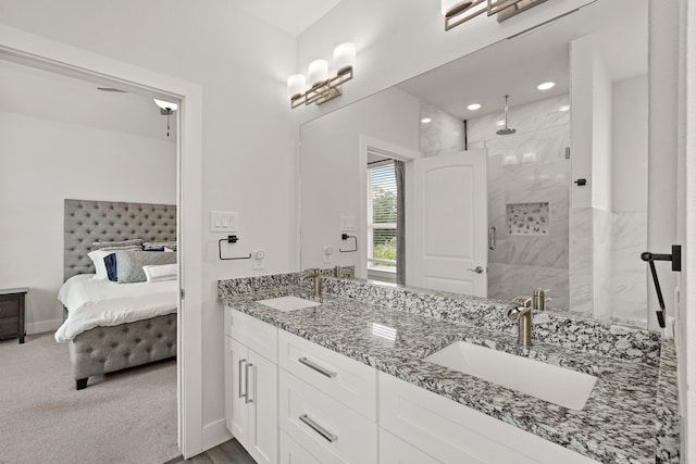 bathroom featuring vanity and an enclosed shower