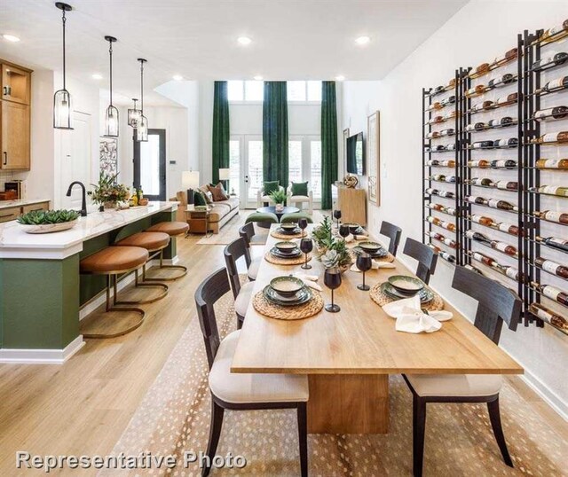 dining area with light hardwood / wood-style floors