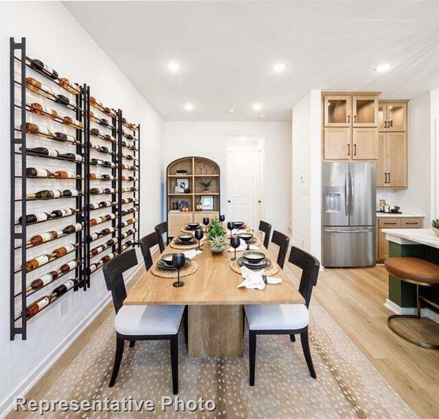 dining room with light hardwood / wood-style floors