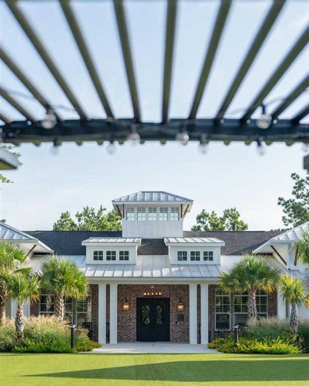 exterior space with french doors and a lawn