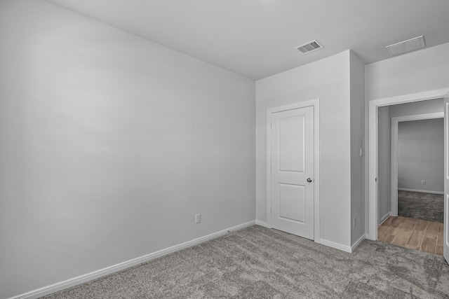 unfurnished bedroom with light colored carpet