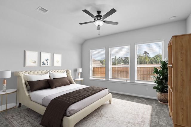 carpeted bedroom featuring lofted ceiling and ceiling fan