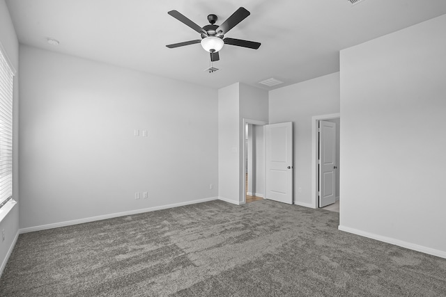 spare room with a wealth of natural light, carpet, and ceiling fan