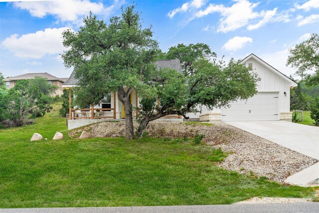 view of front of property with a front lawn and a garage