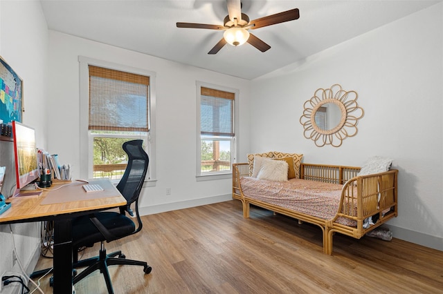 bedroom with ceiling fan and light wood-type flooring