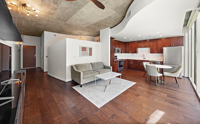 living room with sink and dark wood-type flooring