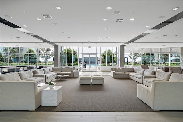 living room featuring floor to ceiling windows