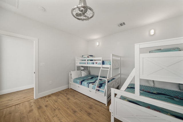 bedroom with hardwood / wood-style floors