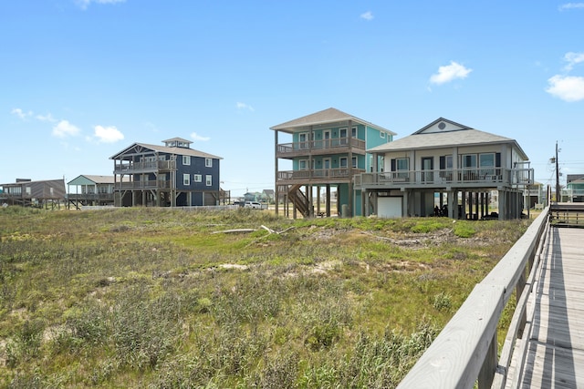 rear view of property with a garage