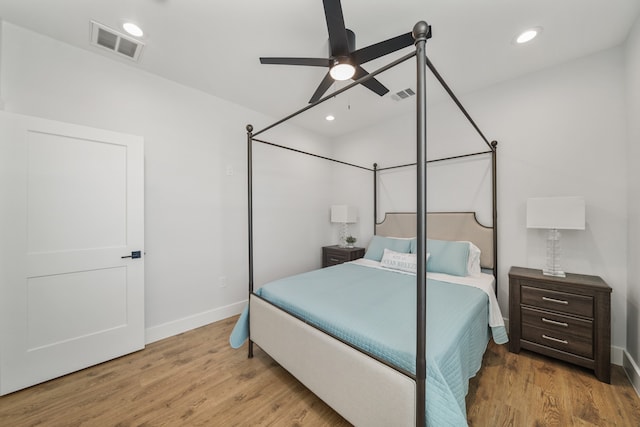 bedroom with ceiling fan and light hardwood / wood-style floors