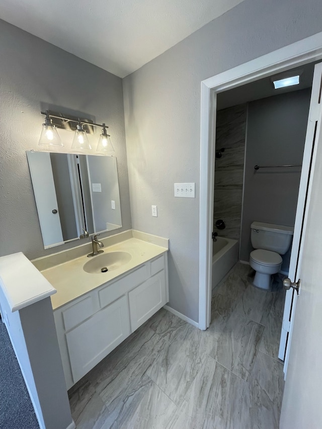 full bathroom with toilet, vanity, and shower / bathtub combination