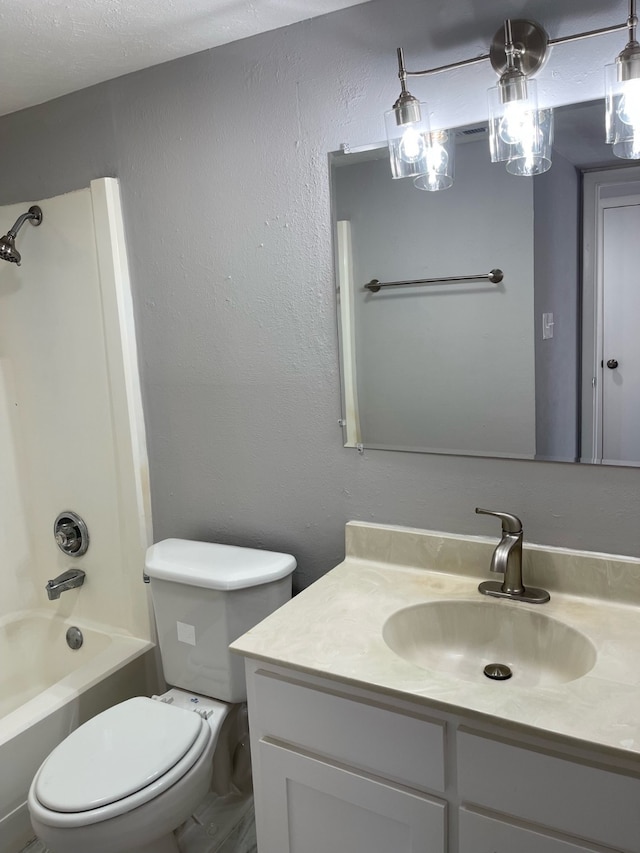 full bathroom with toilet, bathtub / shower combination, and vanity