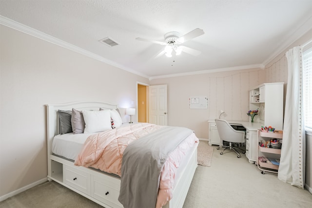 bedroom featuring a textured ceiling, ornamental molding, light colored carpet, and ceiling fan