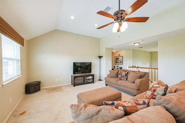 living room featuring lofted ceiling, light carpet, and ceiling fan