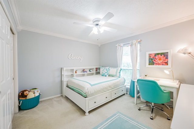 carpeted bedroom featuring ornamental molding, a textured ceiling, a closet, and ceiling fan