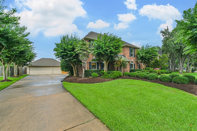 view of front of property featuring a front yard and a garage