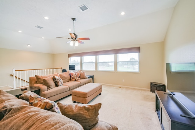 living room with lofted ceiling, light colored carpet, and ceiling fan