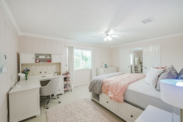 bedroom with ceiling fan, light carpet, and ornamental molding