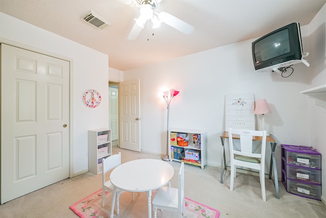 rec room with light colored carpet and ceiling fan