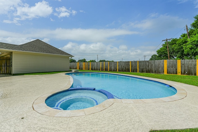 view of pool featuring an in ground hot tub and a patio