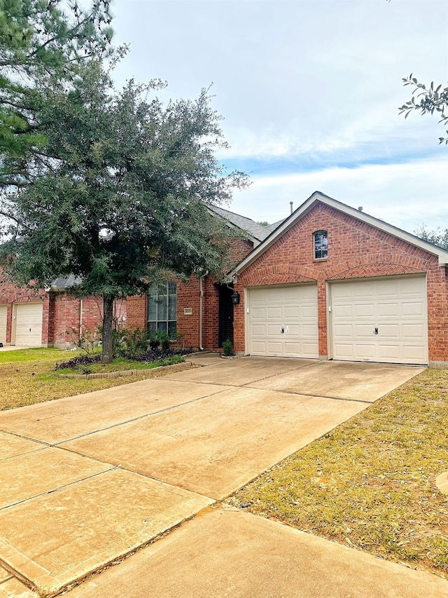 view of front facade with a garage and a front lawn