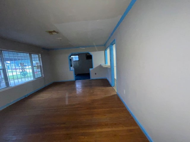 corridor featuring dark wood-type flooring