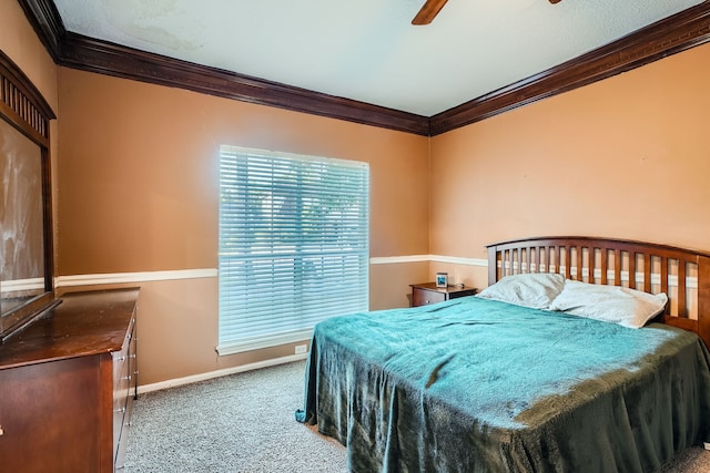 bedroom featuring ornamental molding, ceiling fan, and carpet floors